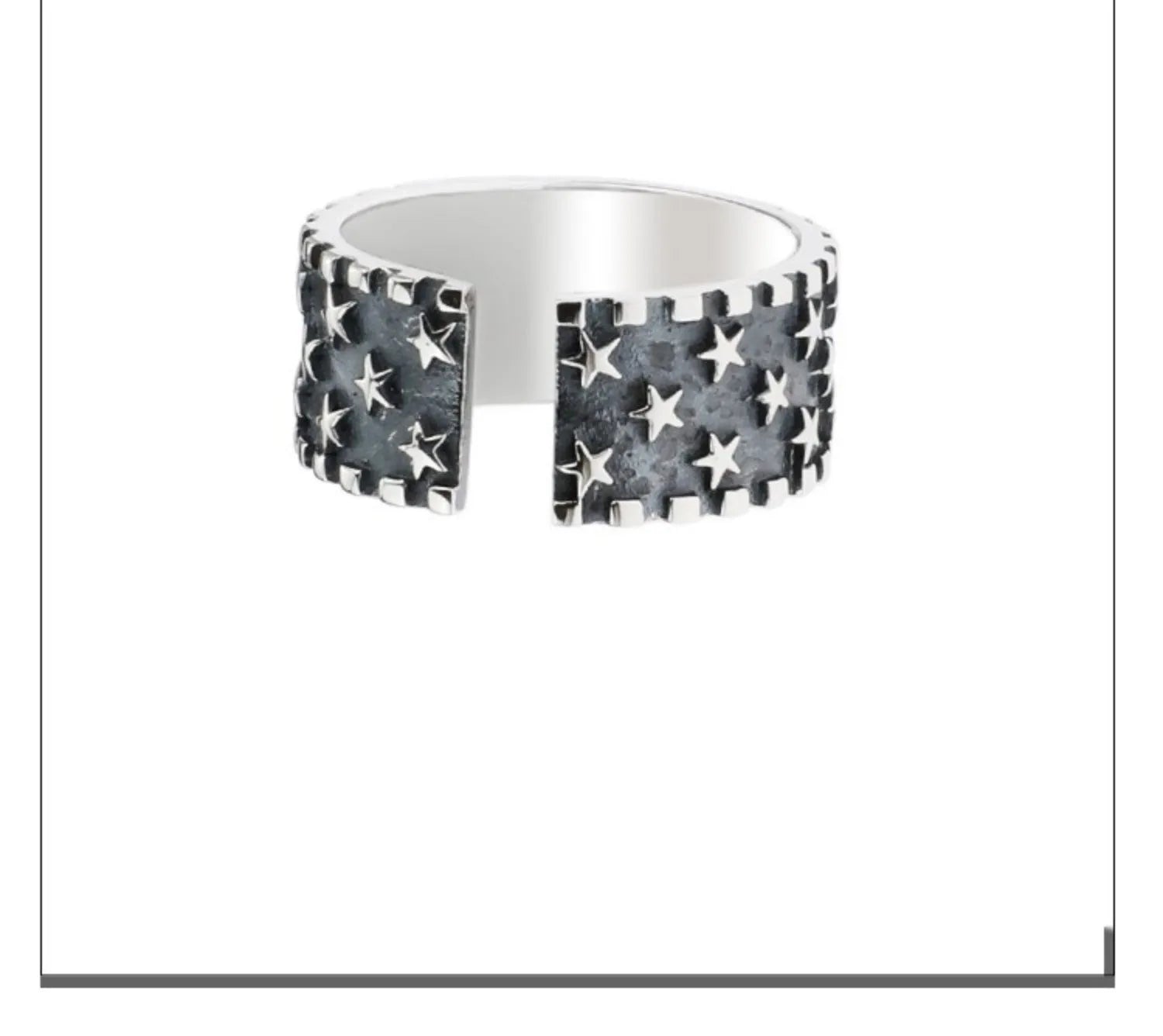 Adjustable sterling silver ring with a raised five-pointed star design on the band.