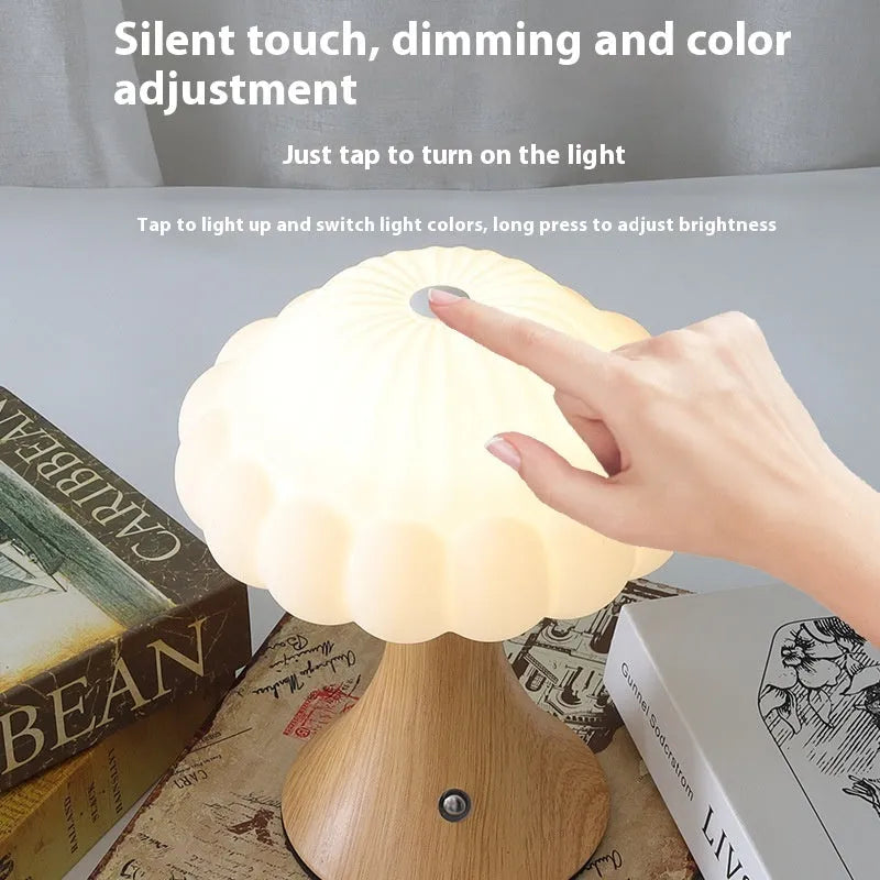 Mushroom-shaped touch control night lamp in wood grain colour on a table