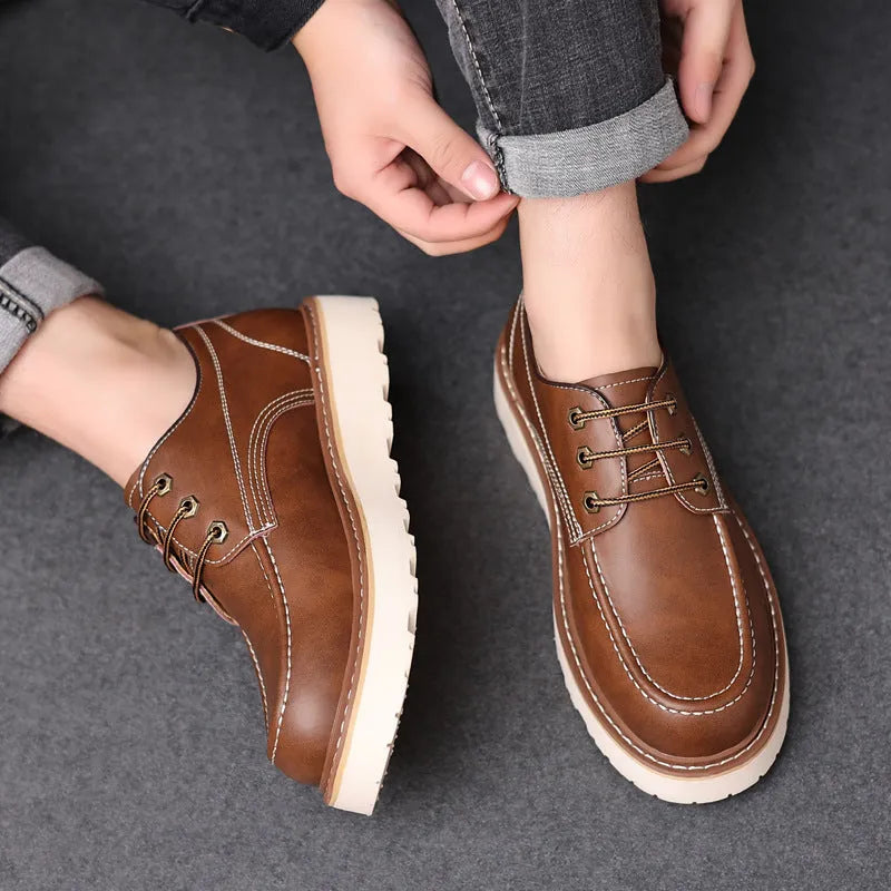 Men's black retro low-top casual boots with a round toe and rubber sole on a white background.