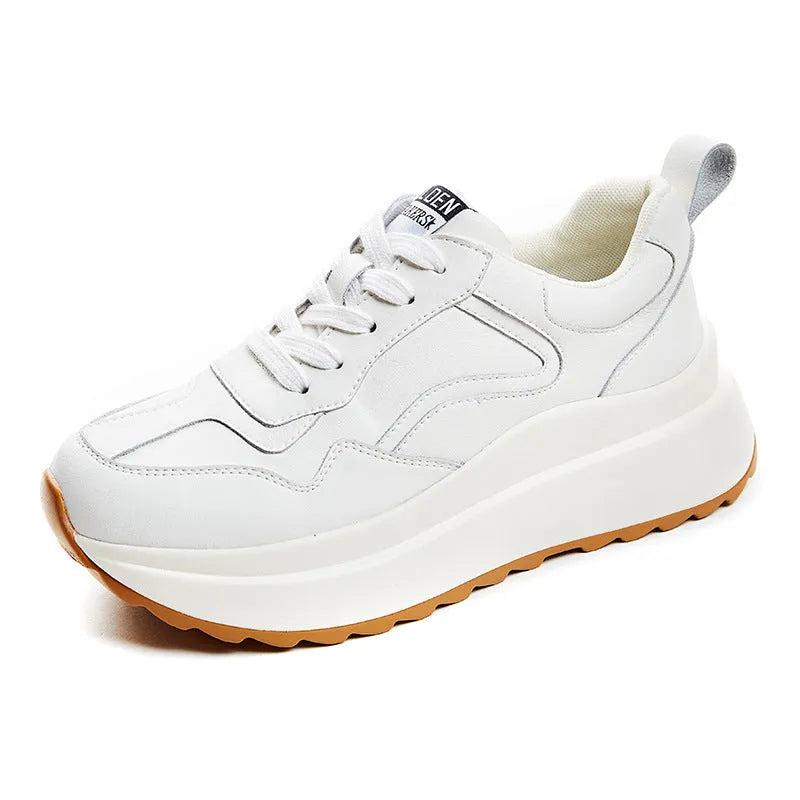Beige women's low-top leather casual shoes with cross strap and a distinctive English muffin heel.