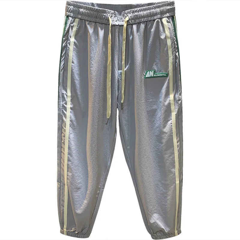 Men's black harem style trousers with mid-waist design and cotton blend fabric