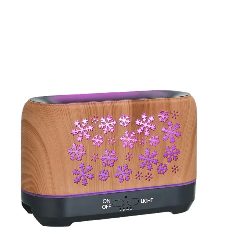 Wood grain snowflake pattern humidifier with colourful flame mist effect on desktop