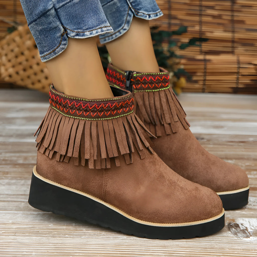 Women's suede wedge ankle boots in dark brown with a side zipper and tassel detail.