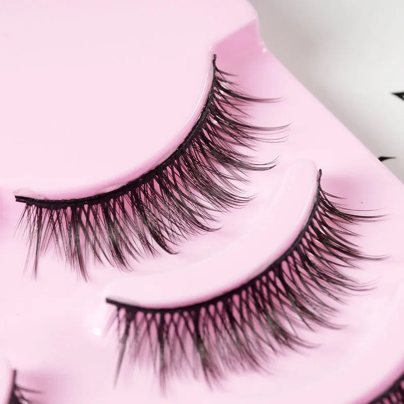 Set of manga-style false eyelashes showing three wispy designs with black plastic bands.