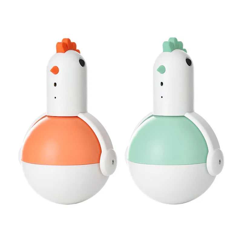 Green and orange electric cat toy with laser light feature on a wooden floor.