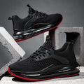 Men's black mesh low-top running shoes with white rubber sole on a plain background.