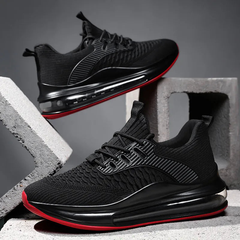 Men's black mesh low-top running shoes with white rubber sole on a plain background.