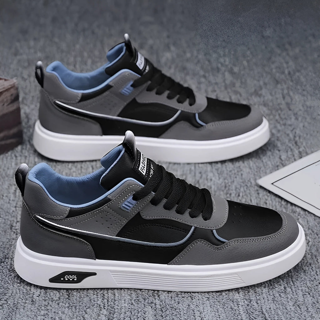 Men's low-top canvas board shoes in black with leather stitching and a mesh lining.