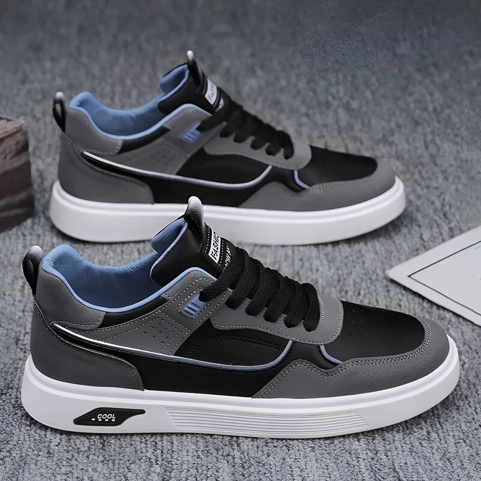 Men's low-top canvas board shoes in black with leather stitching and a mesh lining.