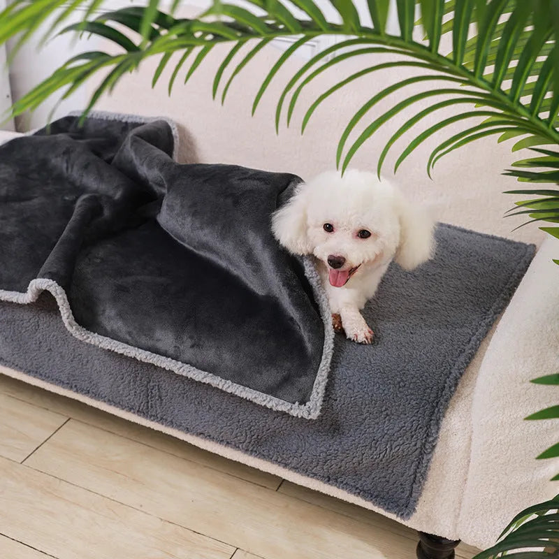 Flannel fleece composite thickened waterproof pet pad in blue gray, on a dog bed, available in multiple sizes