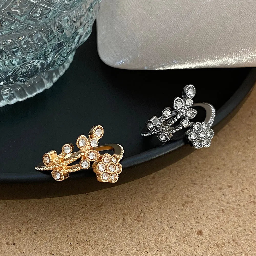 Women's open ring with floral leaf design in gold or white colour on copper
