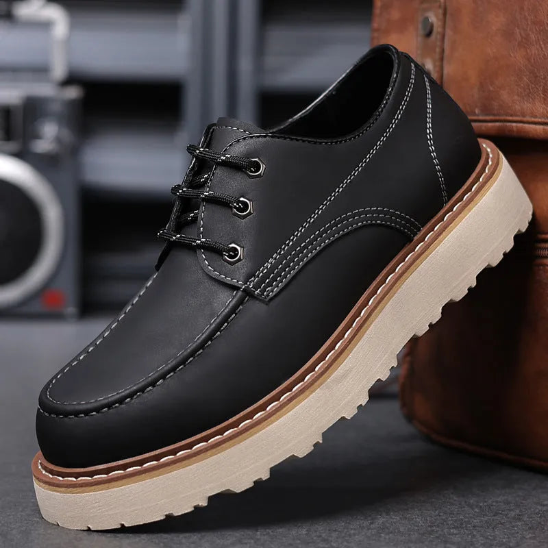 Men's black retro low-top casual boots with a round toe and rubber sole on a white background.