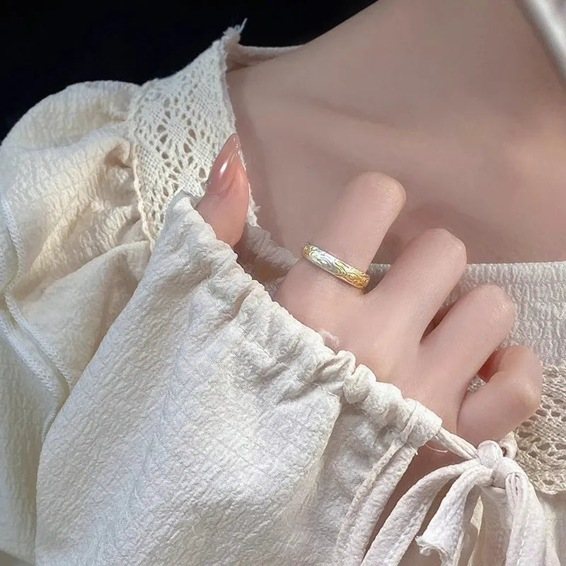 Geometric white copper open ring with silver and gold electroplated Xiangyun pattern.