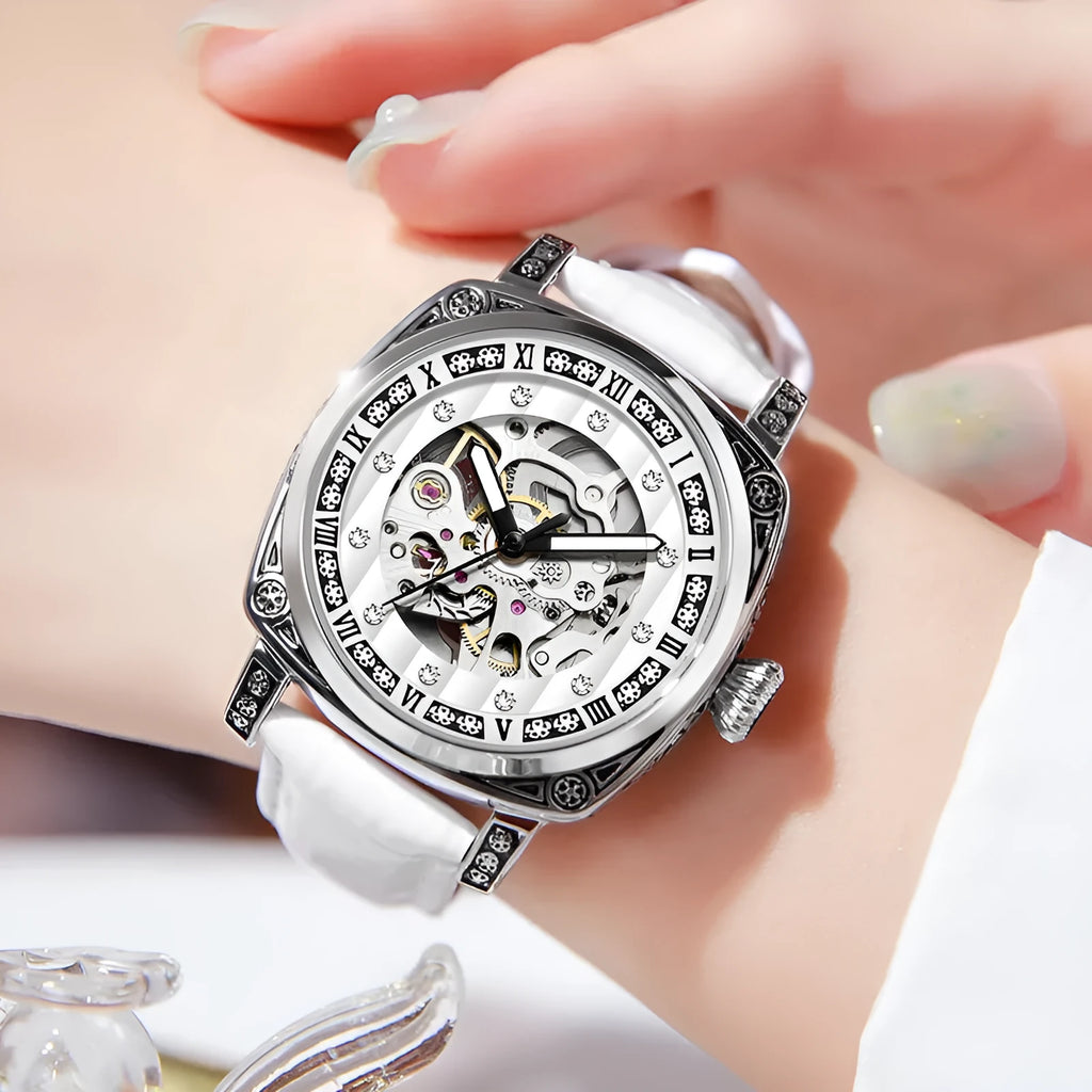 Mechanical wristwatch with luminous hands on a leather strap, shown in multiple colour variants.