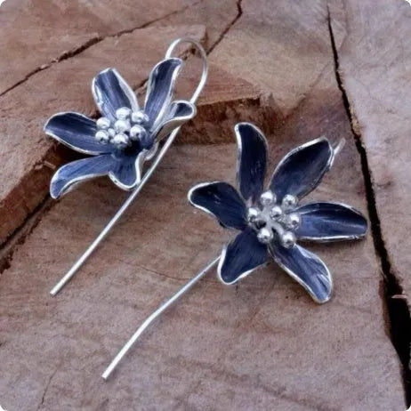 Purple flower-shaped alloy earrings with electroplated finish and retro styling