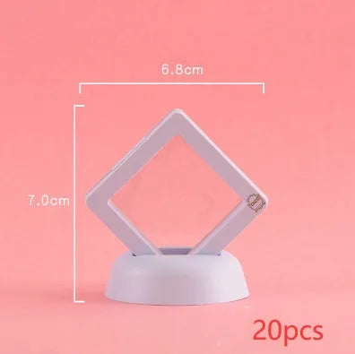 Transparent 3D floating display case holding a coin, with black and white size options