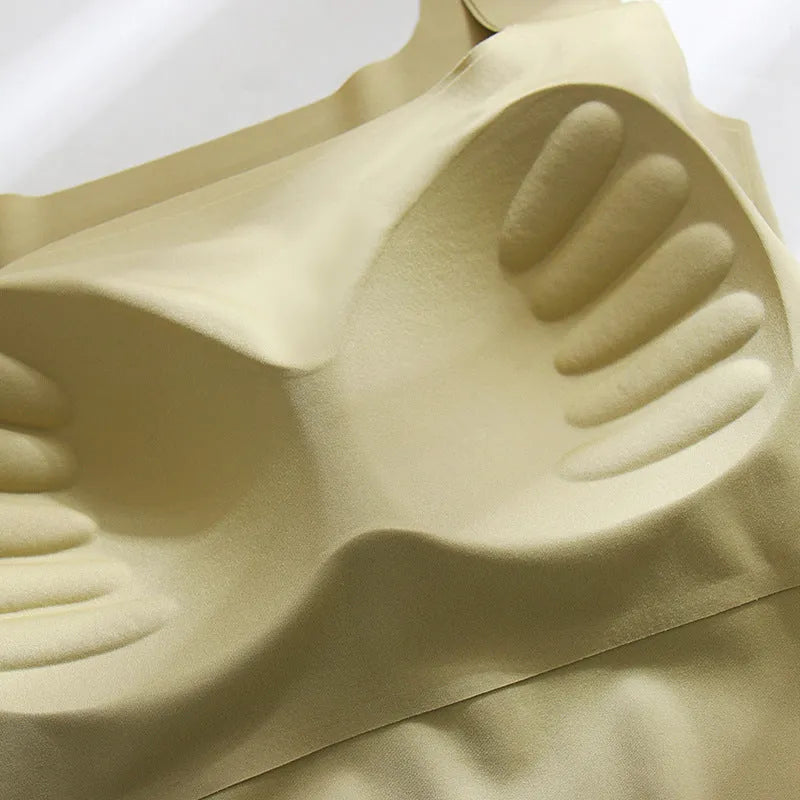Women's non-marking sling vest in light blue, showing seamless design and abdominal length.