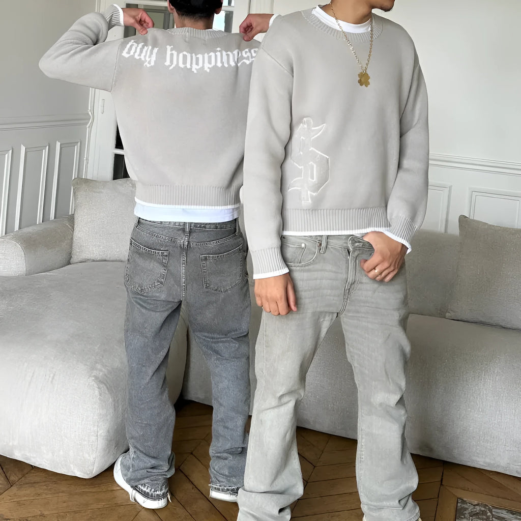 Grey loose-fitting jacquard knitwear pullover coat with long sleeves for autumn winter wear.