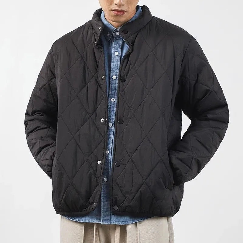 Men's black diamond lattice pattern winter jacket showing lengthened cut and medium thickness