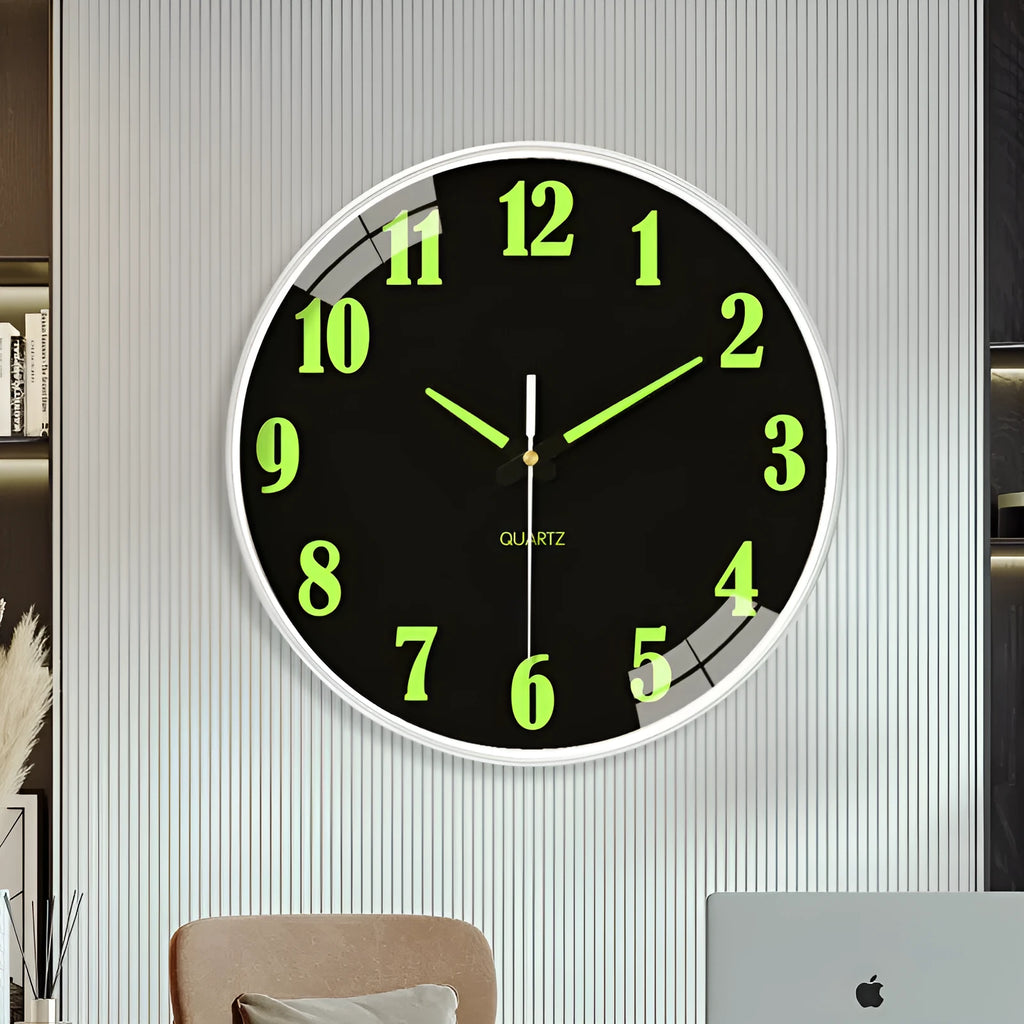 Modern 8 inch diameter luminous wall clock with plastic shell on a wall.