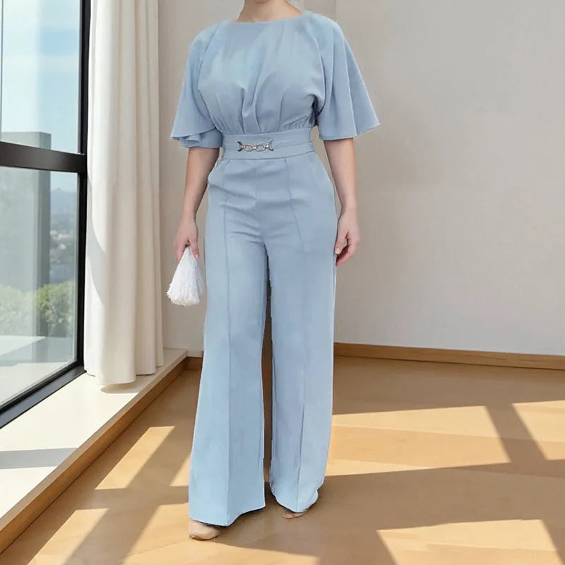 Blue men's casual polyester suit with trousers and a long-sleeve jacket on a hanger.