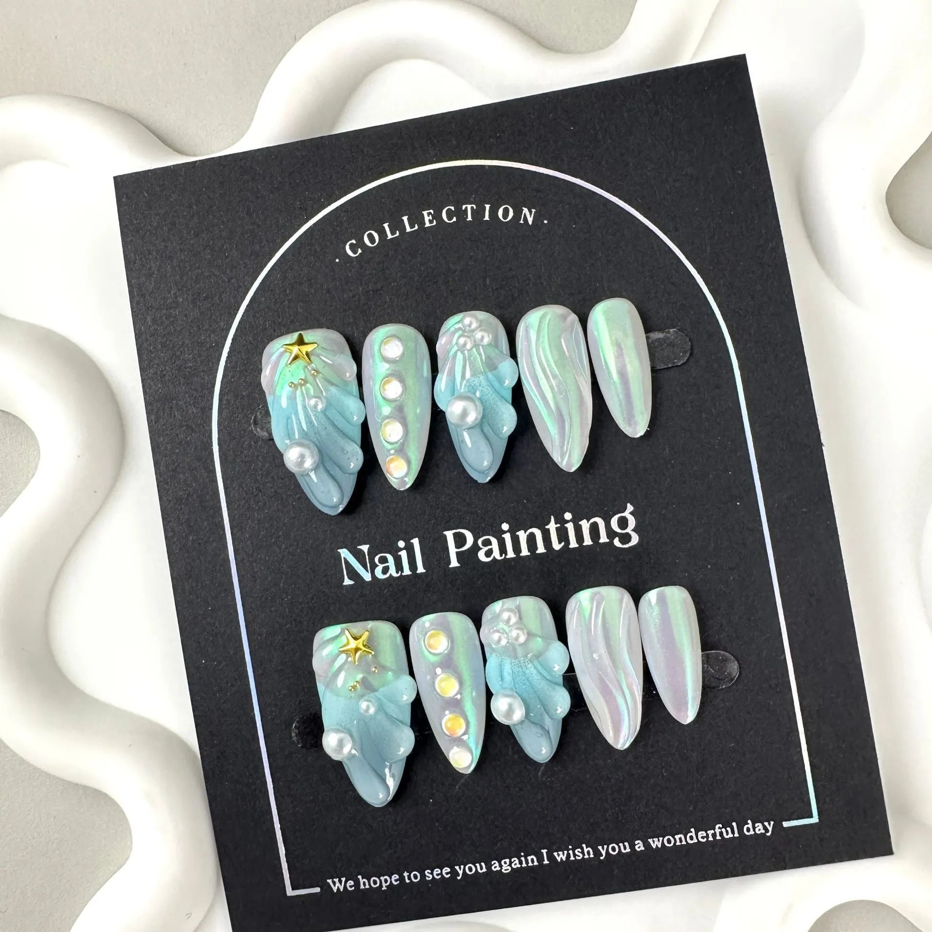 HAILANG blue plastic shell nail sticker set in sizes XS, S, M, L on a white background.