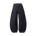 Men's wide leg denim trousers in original cow colour, showing mid waist and relaxed fit.