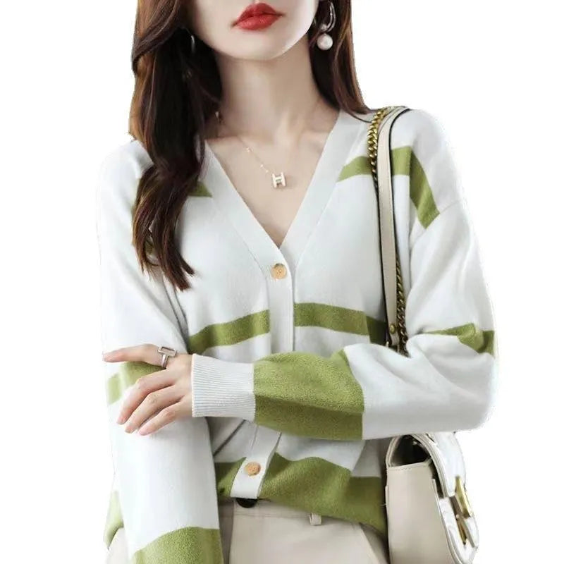 Women's slim-fit V-neck cardigan with 3D striped pattern and button front in assorted colours.