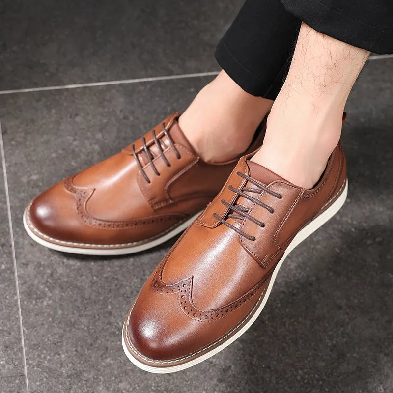 Men's black and brown slip-on business casual shoes with round toe and sculptured detailing