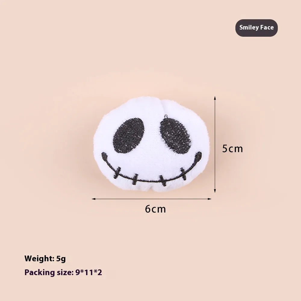Plush cat teaser toy with long wand handle showing candy and skull designs