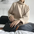 Women's loose-fit long sleeve top with a half-high collar in solid apricot colour, laid flat.