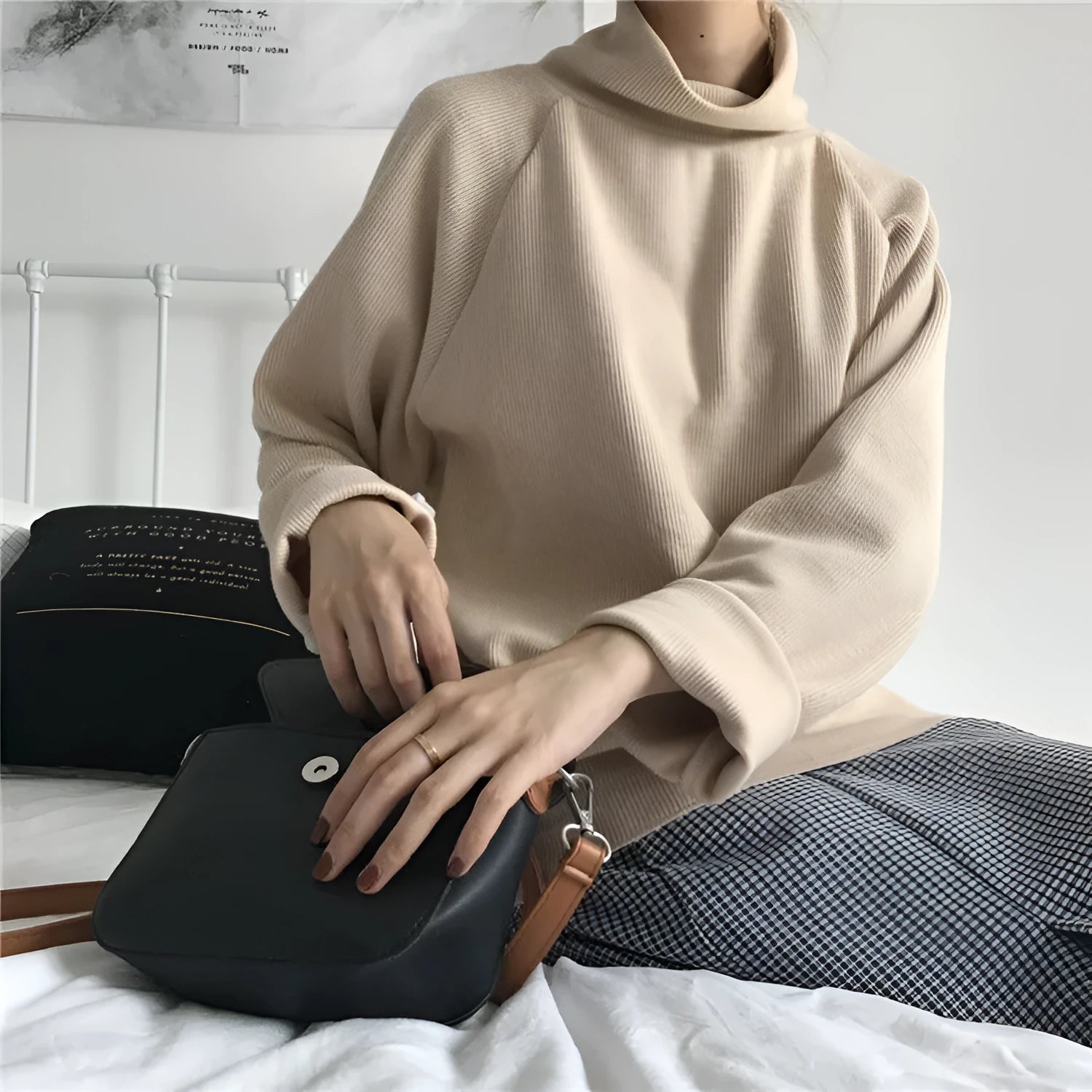 Women's loose-fit long sleeve top with a half-high collar in solid apricot colour, laid flat.