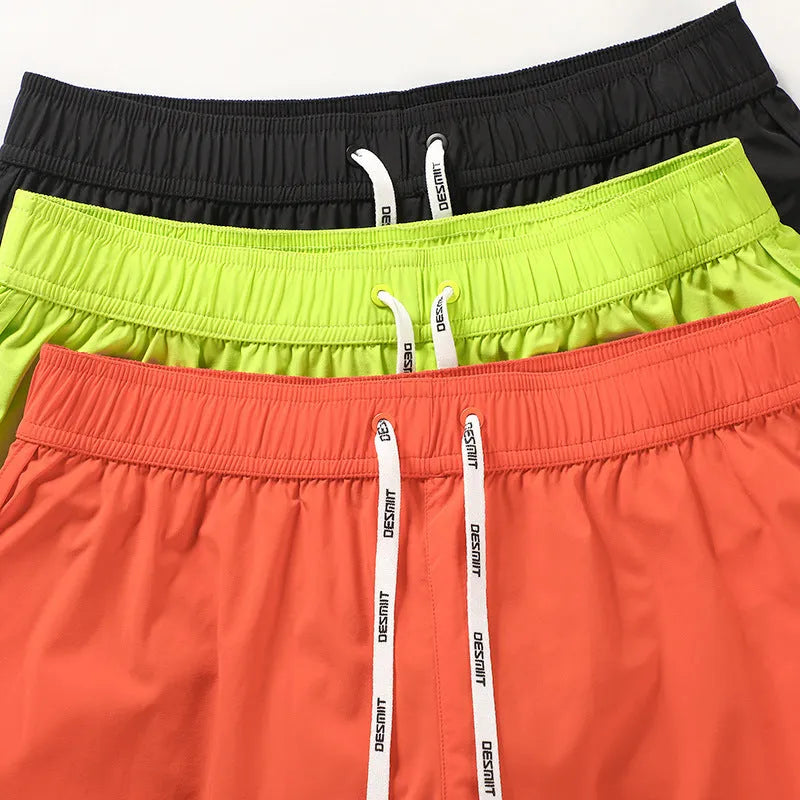 Men's loose fit polyester beach surfing shorts in fluorescent green with micro-elastic waistband