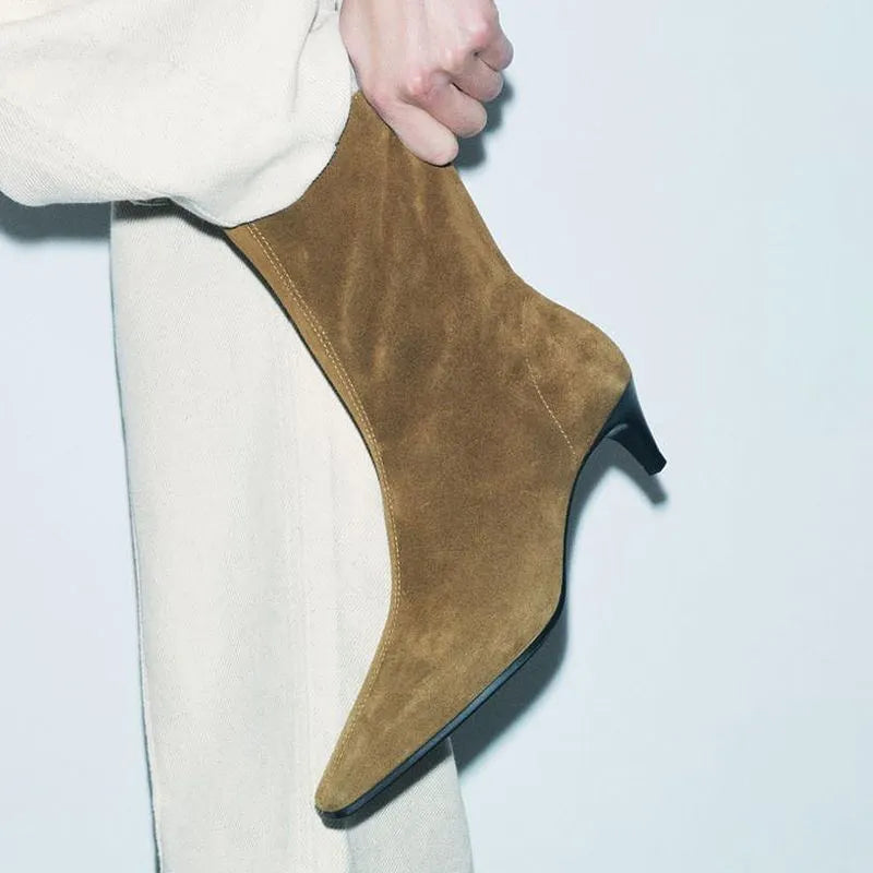 Women's brown square toe ankle boots with a stiletto heel and side zipper on a white background