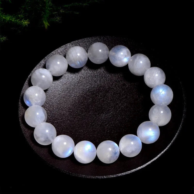 Natural blue moonlight moonstone round bead bracelet showing polished stone surface and blue sheen