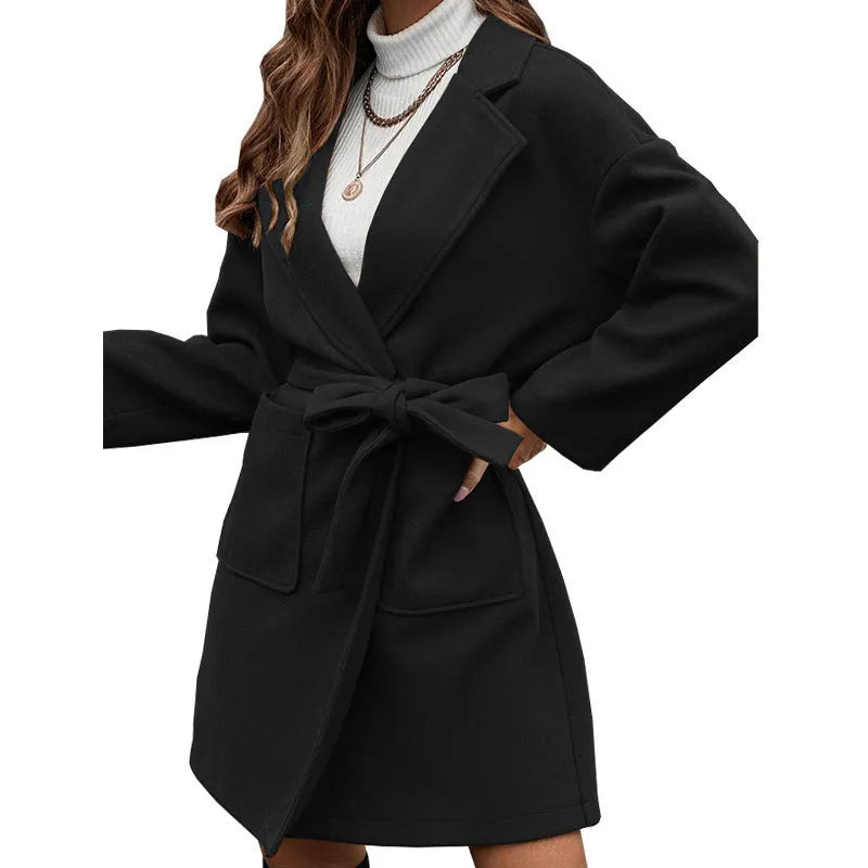 Minimalist long sleeve belted coat in thick fabric shown in a choice of colours.