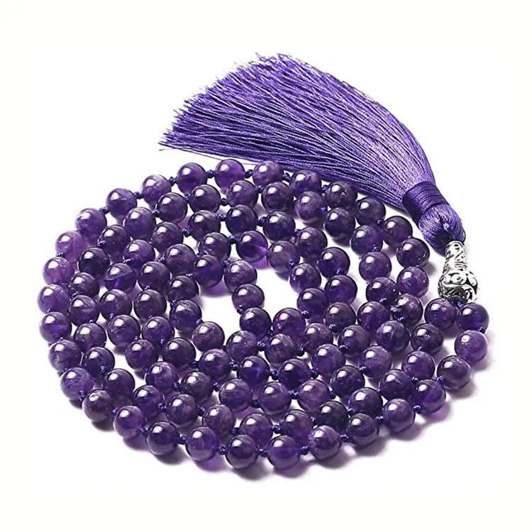 Long beaded agate and amethyst tassel necklace with blue grain stone and lapis lazuli on a geometric design.