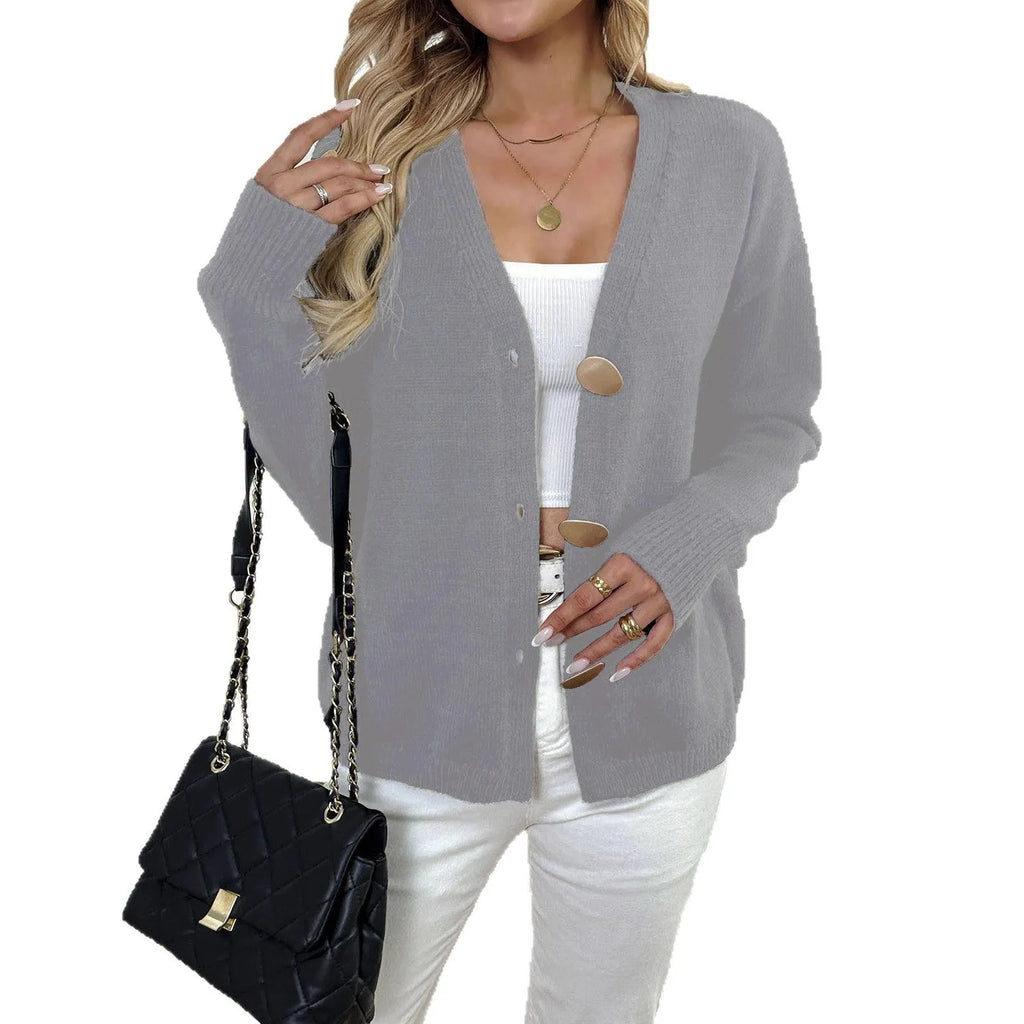 Women's grey deer plush sweater coat with long princess sleeves on a hanger.