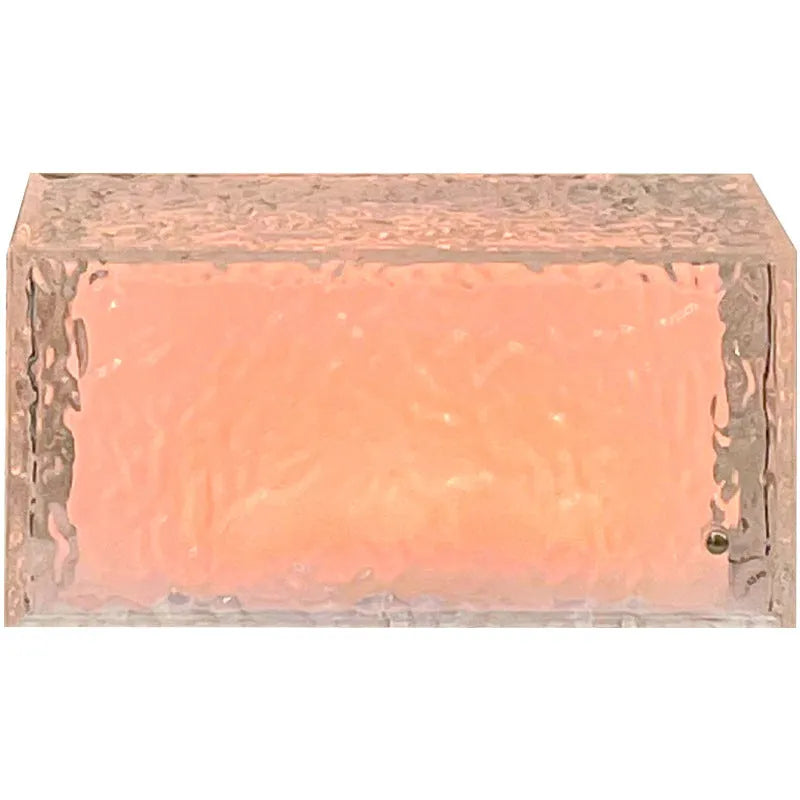 Clear acrylic geometric ice cube shaped small night light with internal LED glow.