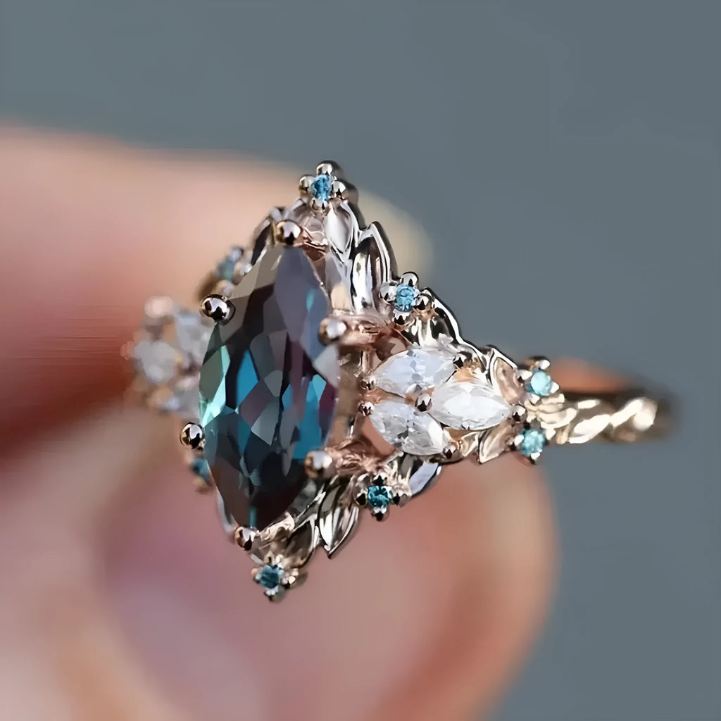 Rose gold copper ring with hollow out brushed finish and inlaid zircon stones in flower and leaf design