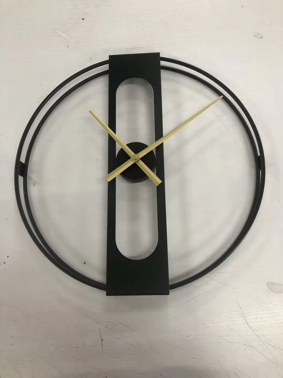 Round metal wall clock measuring 50cm in diameter available in black or gold colour