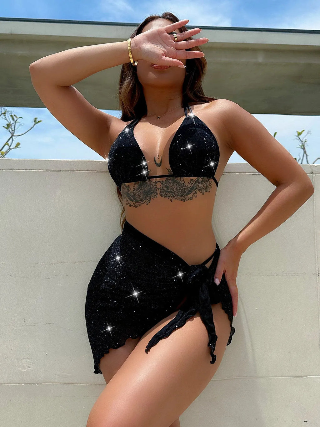 Black polyester bikini three-piece swimsuit set with triangle top and matching shorts