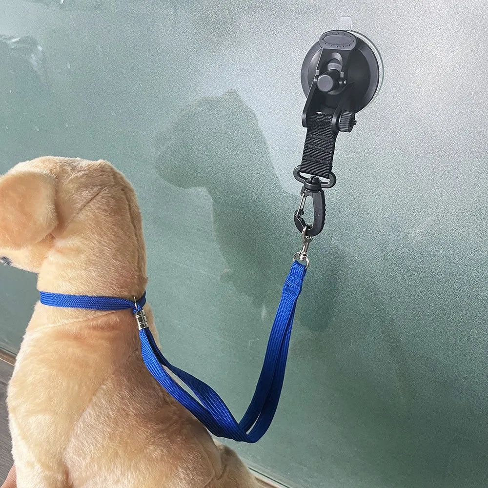Pet bathing restraint with adjustable rope, handcuffs, and suction cups in black or blue colours