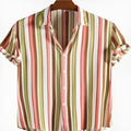 Men's short sleeved digital printed shirt in a colourful pattern, laid flat.
