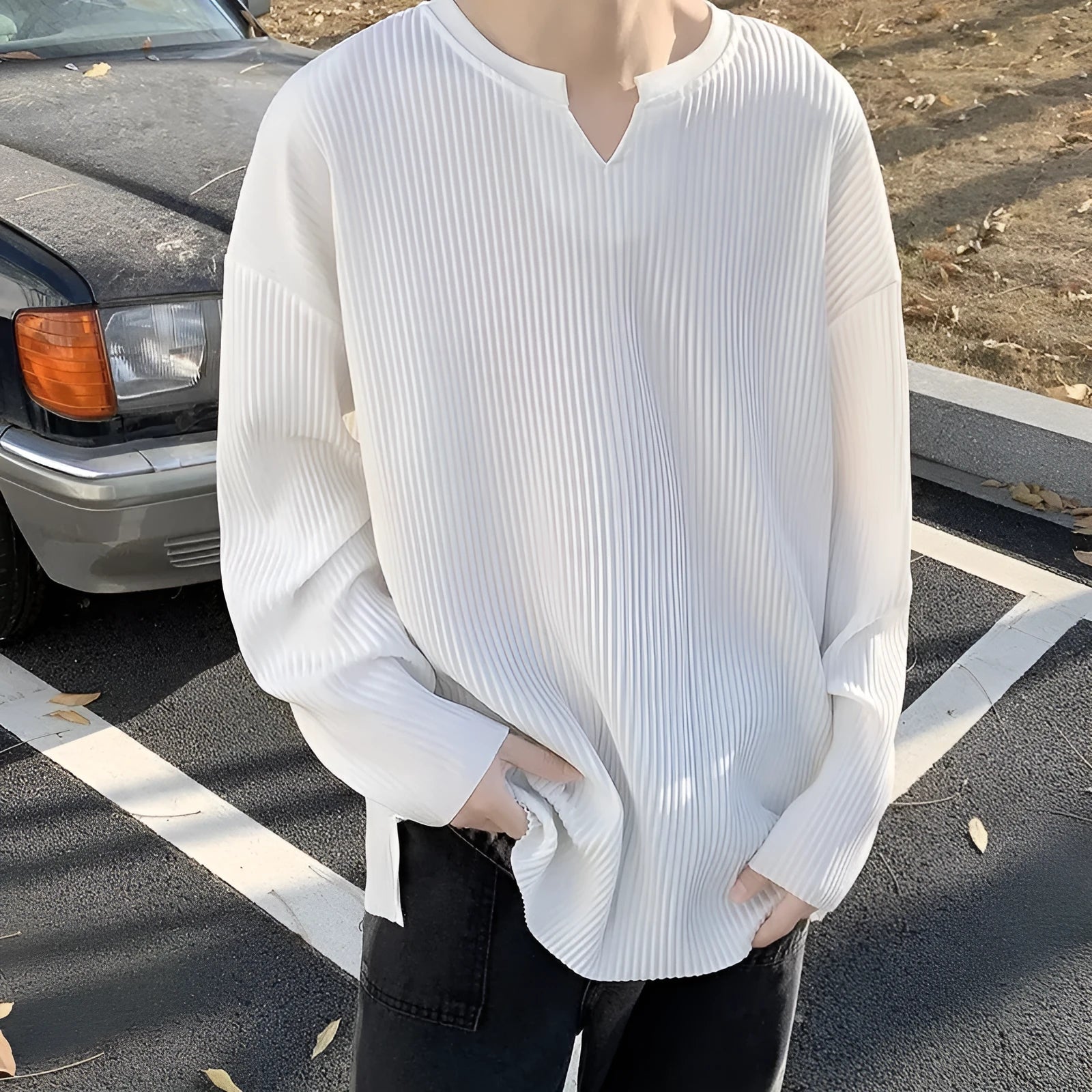 Plus size striped texture draping solid colour pullover in black, long sleeves, loose fit, front view