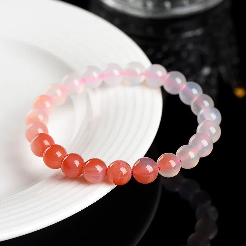 Natural gradient Yanyuan agate bracelet with geometric beads in a salt source colour, shown with size options.
