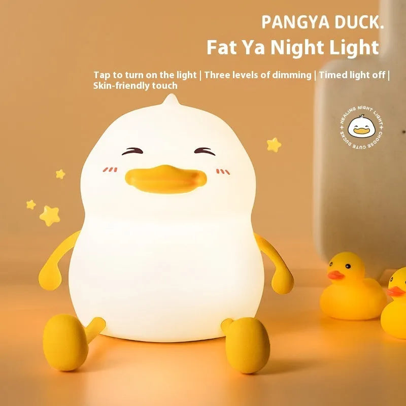 Chubby silicone night lamp with phone holder function showing compact design and adjustable LED lighting