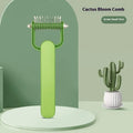 Green dog grooming comb with stainless steel teeth for detangling matted pet hair