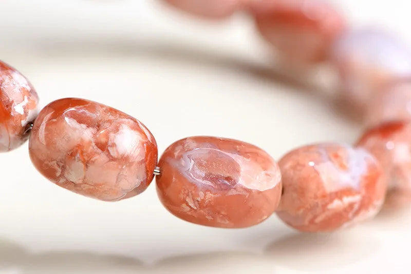 Natural cherry blossom agate barrel bead bracelet with ruyi pattern design