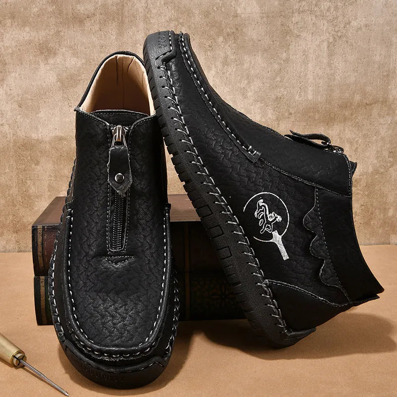 Men's black PU leather slip-on loafers with a round toe and sewn rubber sole on a white background.